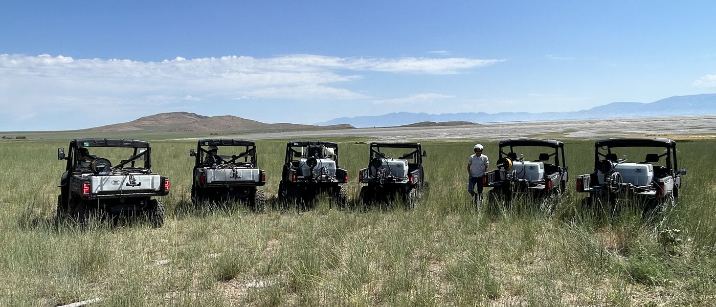 Spray crew and side-by-sides staged for a Russian knapweed day